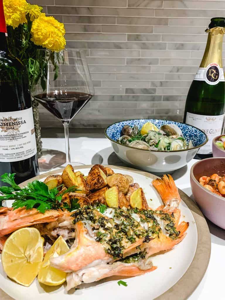 spread of Greek inspired food and Greek wine