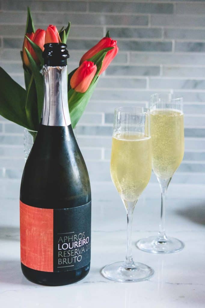 aphros loureiro sparkling wine with 2 flutes