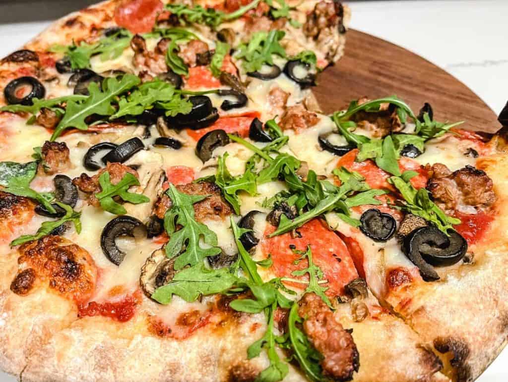 wood fired pizza with various toppings