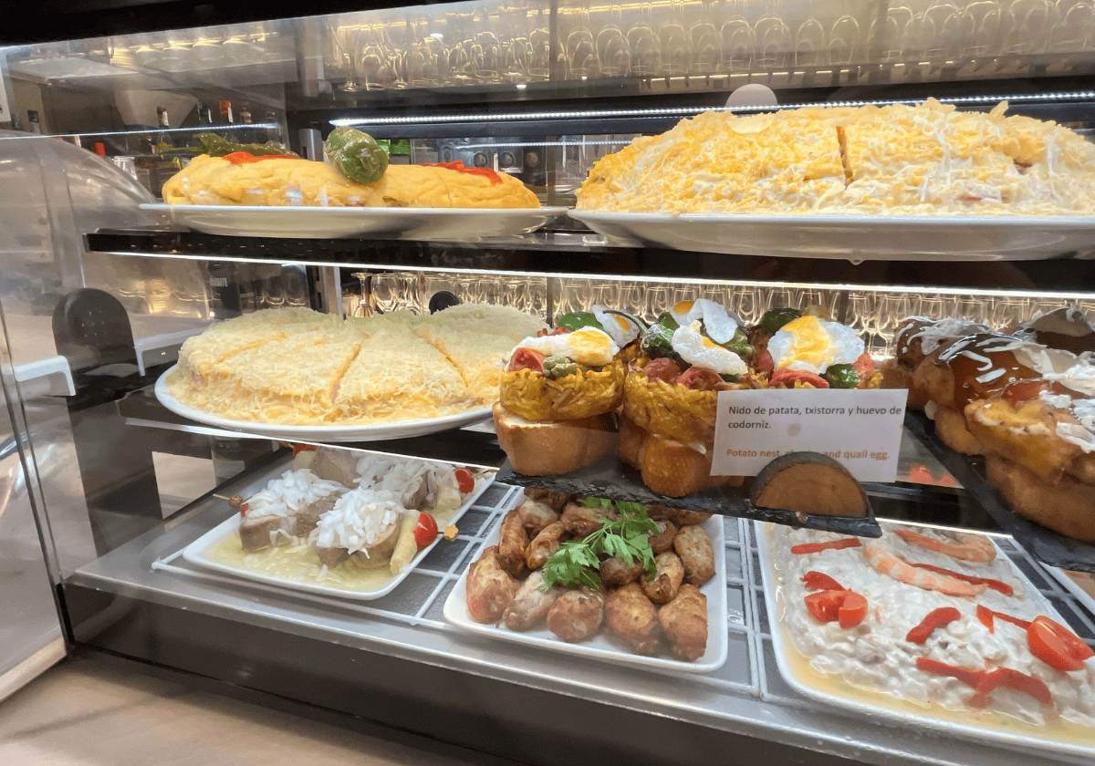Potato frittatas and pintxo deli case at a restaurant in La Guardia, Spain
