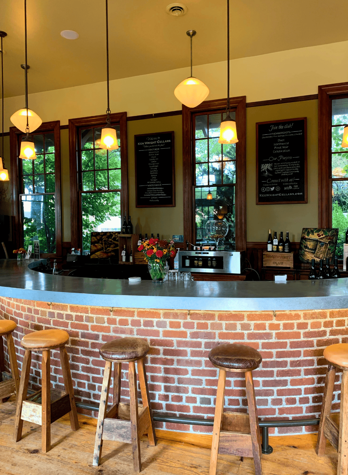 The Ken Wright tasting room with a zinc counter and stools.