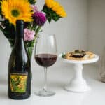 2017 Ken Wright Shea Vineyards pinot noir with a fig and blue cheese tart on a cake stand.