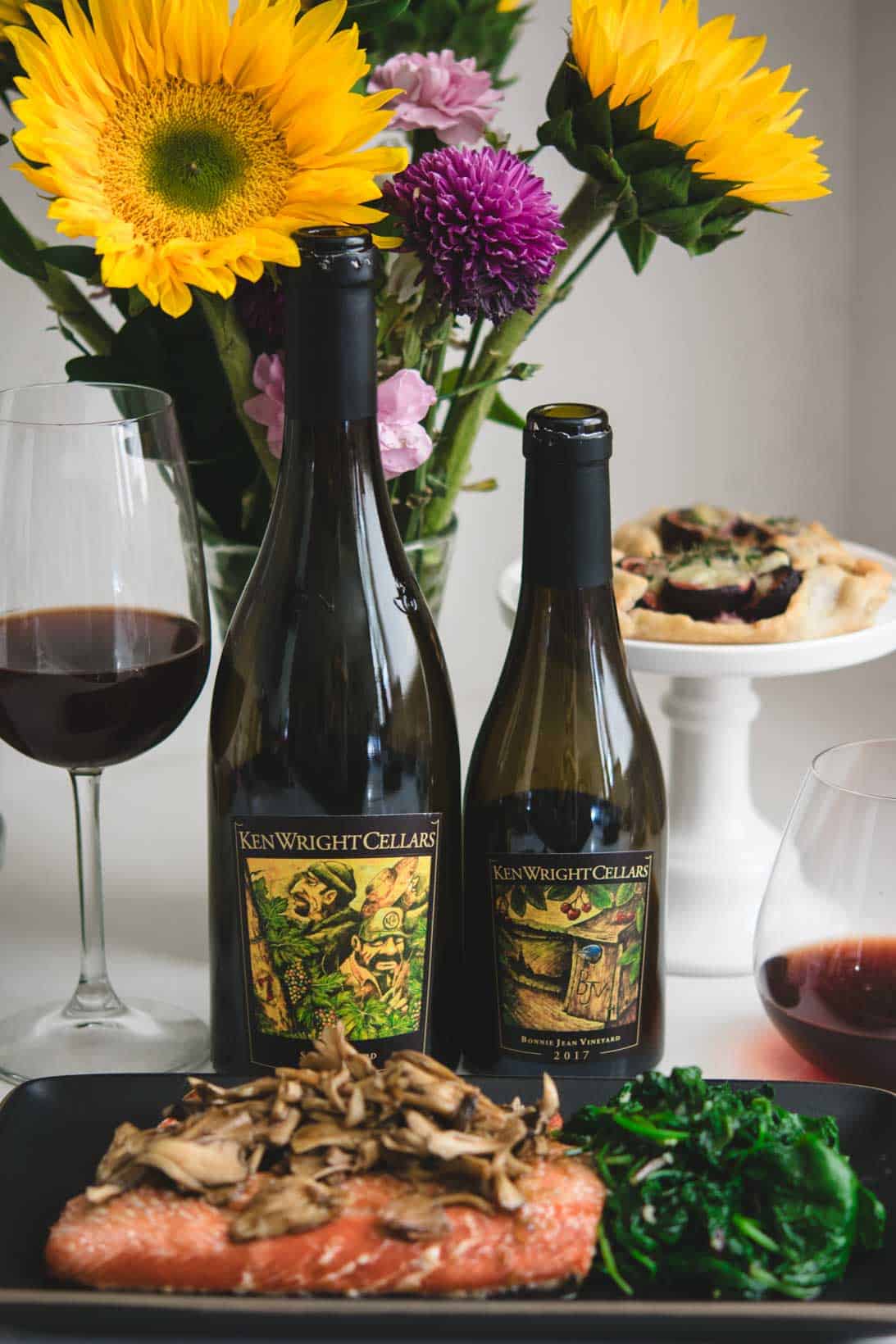 Ken Wright Cellars pinot noir wines with a black plate of salmon.