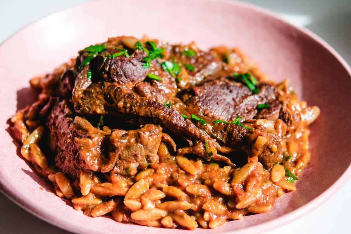 Lamb Manastra on a pink round plate
